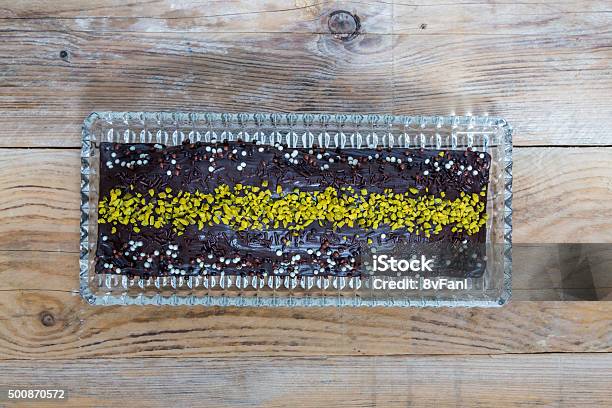 Chocolate Cake With Pistachio On Raw Wood Stock Photo - Download Image Now - 2015, Baked, Cake