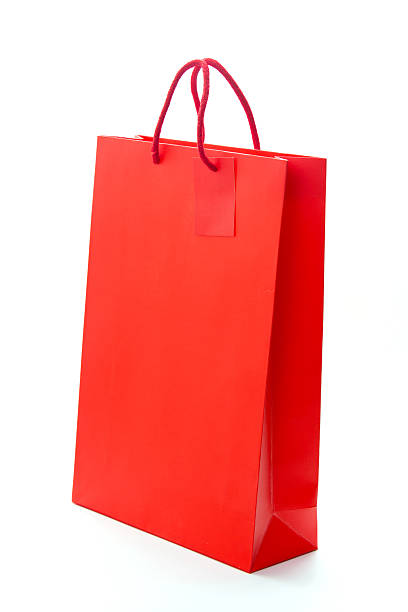 istock Red shopping paper bag on isolated background 500871589