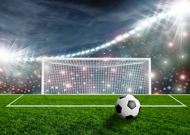 istock Soccer ball on green stadium arena 500873011