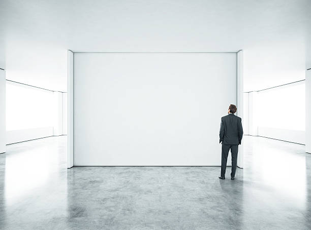 istock Young businessman standing in bright office 500874253