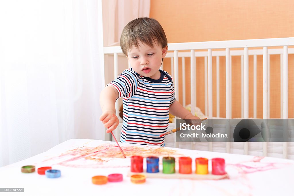 lovely baby painting at home lovely baby boy painting at home 12-23 Months Stock Photo