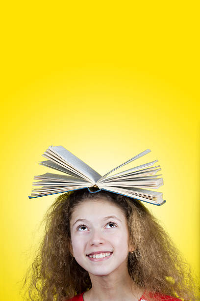 istock Cute little schoolgirl loving to learn 500874738