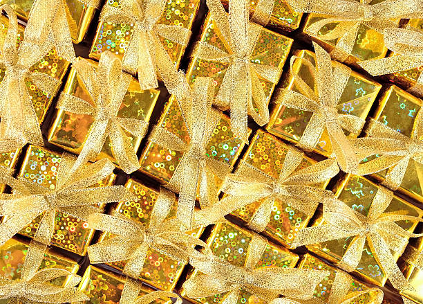 Top view of golden gifts as background