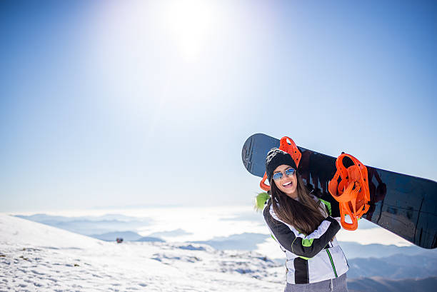 Snowboard girl Snowboard girl at the top of mountain enjoy a sunny day snowboard stock pictures, royalty-free photos & images
