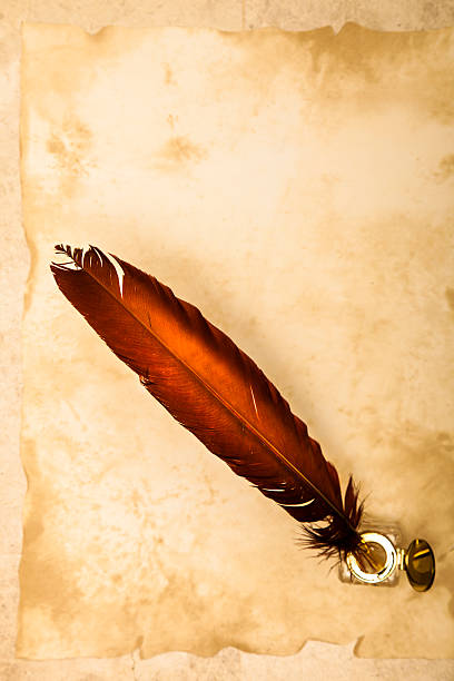 istock Antique quill pen and ink well on parchment 500876866