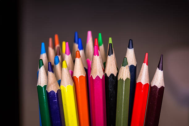 istock Colorful pencils on black background 500878372