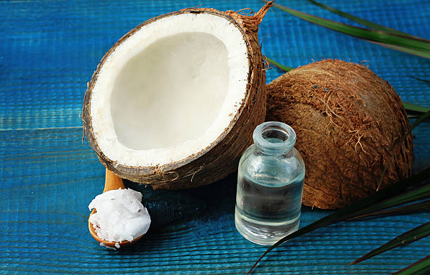 istock Coconut and coconut oil on blue rustic wooden background 500878700