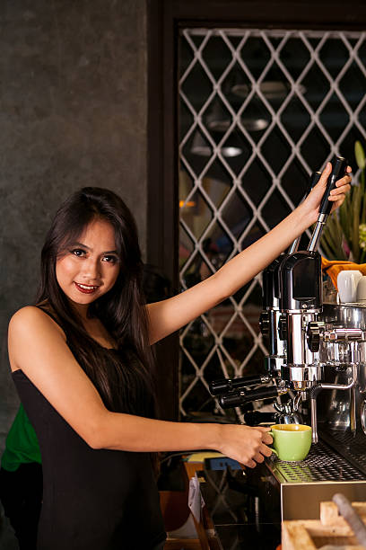 istock Asian Girl on the bar making fresh drink 500880936