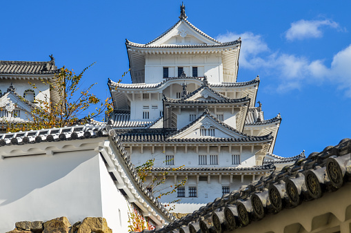 Himeji, Japan - November 27, 2015: Famous Himeji Castle in Japan used by Shoguns and Samurais. Photo was taken during a cold autumn afternoon from the park in front of the castle, and contains no people.