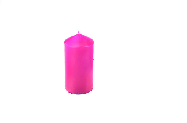 istock Pink candle isolated on white background 500883290
