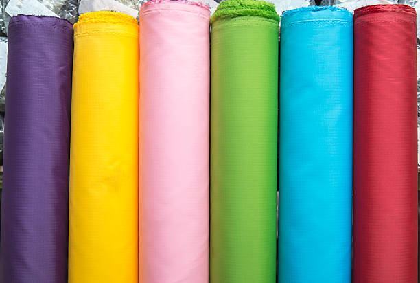 istock Colorful material fabric rolls in warehouse 500883960