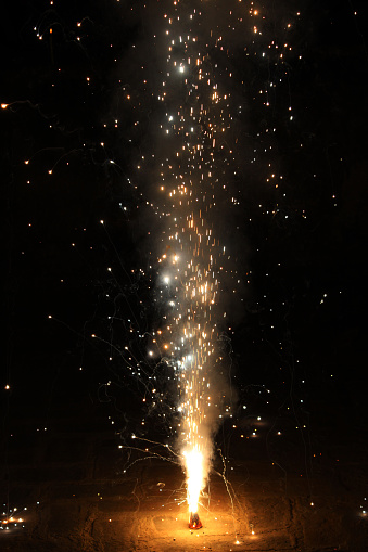 Ground shot of firework display at night.