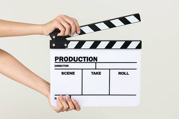 istock Close-up Of Hand Holding Clapperboard On White Background 500886457