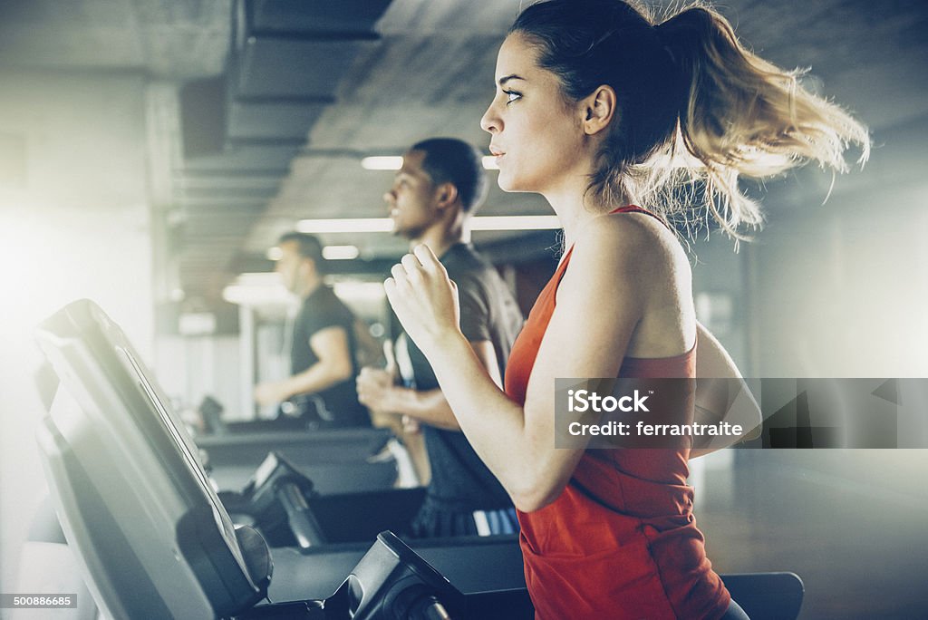 Diverse People Running on Treadmill Gym Stock Photo
