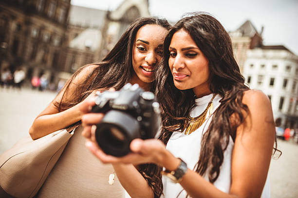istock tourist in amsterdam looking the pictures 500886749