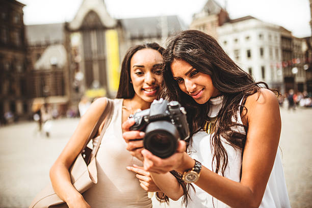 istock tourist looking the pictures on camera 500887783