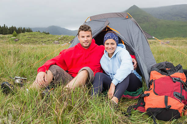 istock Couple on camping trip smiling at camera 500889097