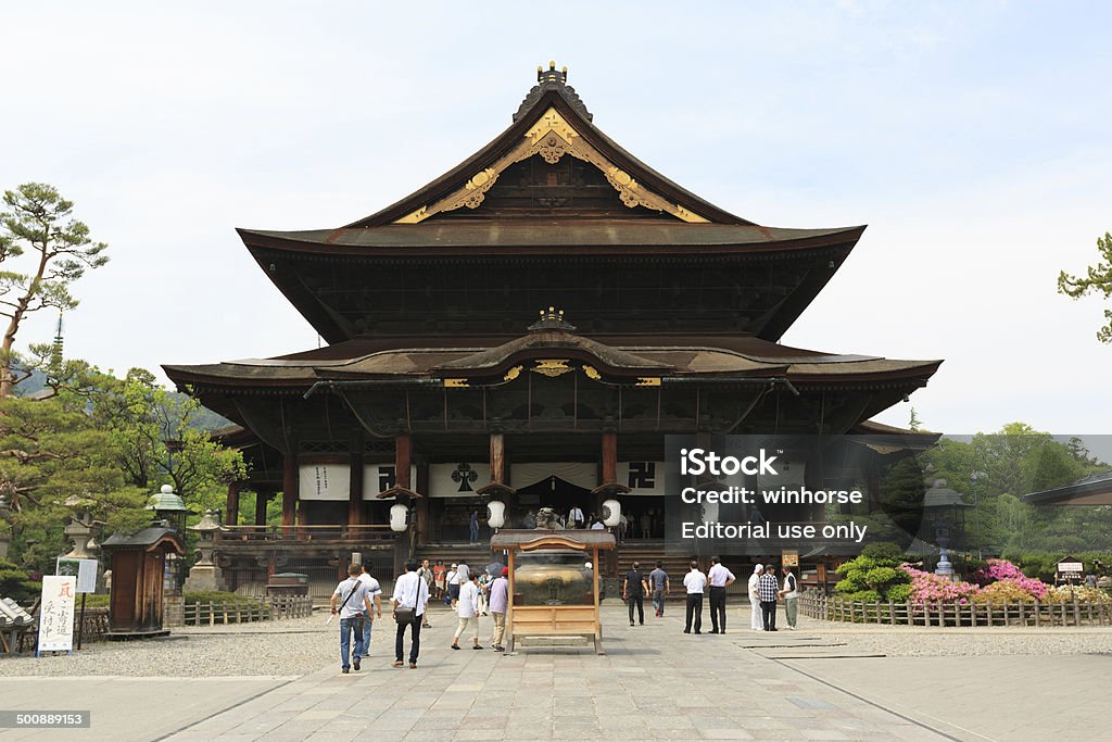 Zenko-ji Temple in Japan Nagano, Japan - June 2, 2014 : People at Zenko-ji Temple in Nagano, Japan. It is a Buddhist temple. The temple was built in the 7th century. Architecture Stock Photo