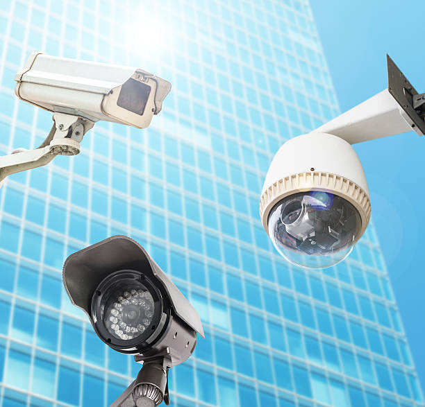 istock CCTV Camera or surveillance orperating with city building in bac 500890453