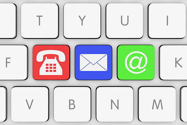 istock Coloured Contact Icons on White Computer Keyboard 500898446