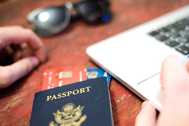 istock passport with credit card and computer concept 500899384