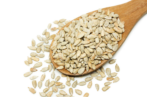 istock Sunflower seed with a wooden spoon. 500902628