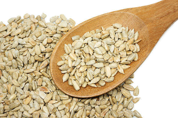 istock Sunflower seed with a wooden spoon. 500902698