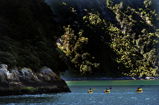 Canoeing on Fiordland national park in southern New Zealand.