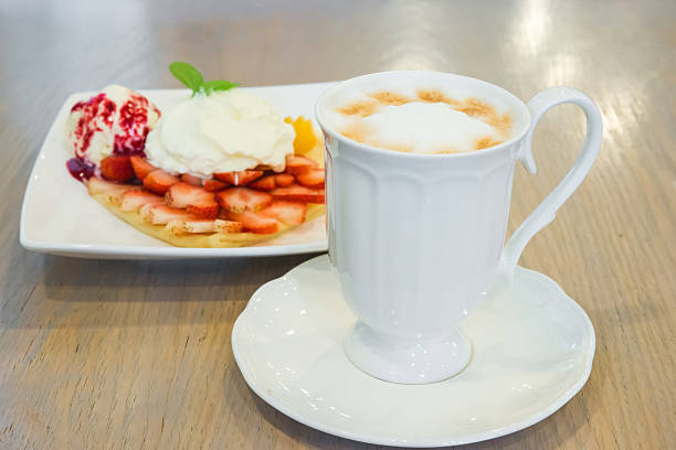 istock Cappuccino coffee cup and vanilla ice cream with strawberry 500904519