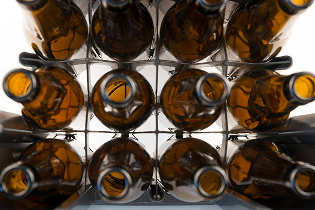 Rows of empty glass bottles in the plastic box