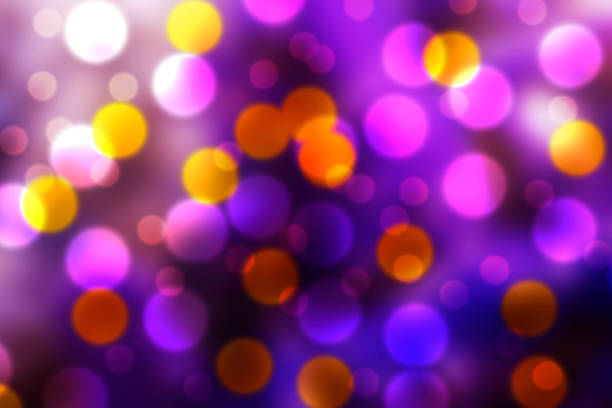 istock purple, orange and white bokeh 500905288