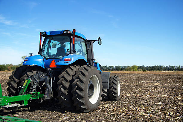 istock Tractor with plow working in the field 500905758