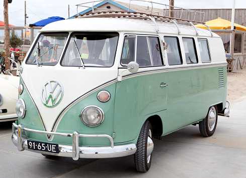 Katwijk, The Netherlands - June 20, 2014: A green Volkswagen Transporter T1. Volkswagen Transporter T1 (also known as Bulli) was a van/minibus. It was built between 1950 and 1967. VW is a brand of the Volkswagen Group, which is a German automobile manufacturing group based in Wolfsburg, Germany and founded in 1937.