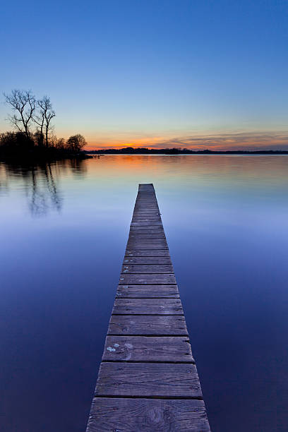 istock Blue Sunset over Wooden Jetty in Groningen, Netherlands 500906533