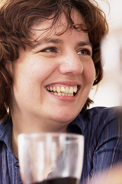 woman drinking with friends stock photo