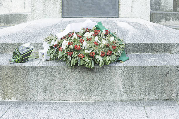 istock Cement tombstone with flowers 500906633