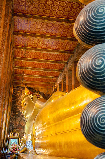 istock Reclining Buddha gold statue in Wat Pho buddhist temple, Bangkok 500907175