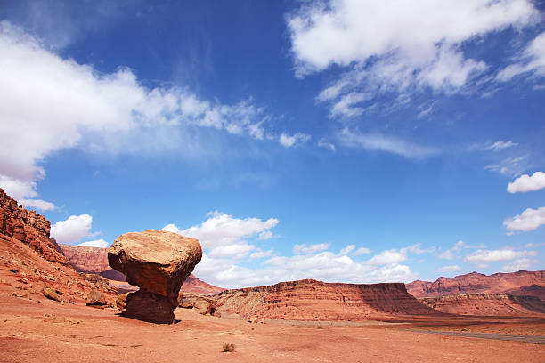 The grand panorama - a stone desert of red sandstone and the famous rock in the form of the fungus. Windy sunny autumn day