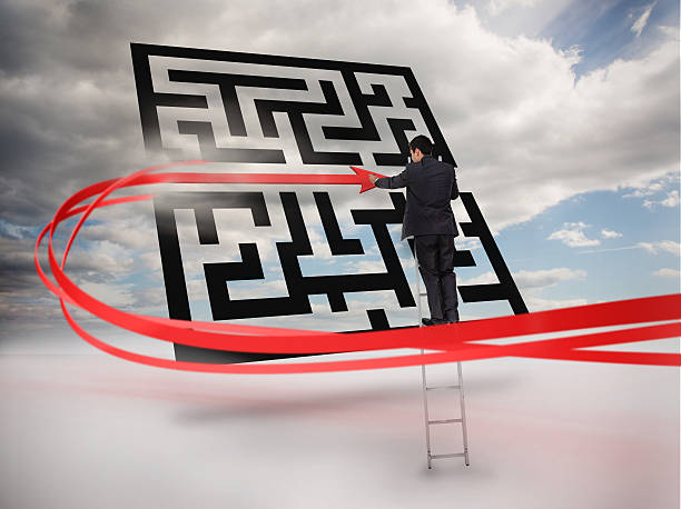 istock Businessman on ladder tracing red line through qr code 500907301