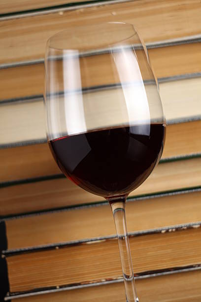 istock Wine glass and books 500908239