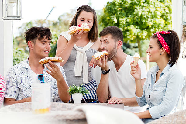 istock Friends eating dessert 500908305