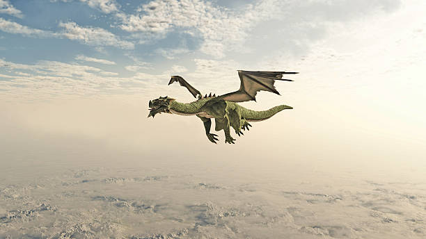 istock Green Dragon Flying through the Clouds 500909551