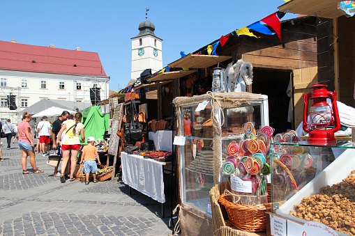 Sibiu, Romania - August 24, 2012: People visit main square on August 24, 2012 in Sibiu, Romania. Sibiu's tourism is growing with 284,513 museum visitors in 2001 and 879,486 visitors in 2009.