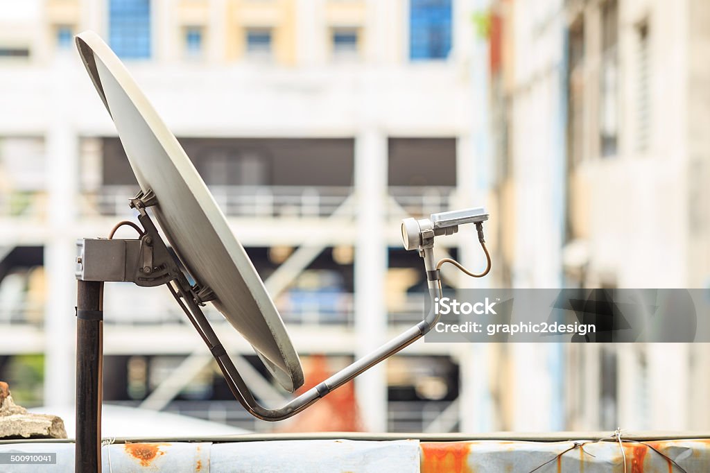 satellite dish receiver on the build signal communicate of Media Technologies ,building background  Accessibility Stock Photo