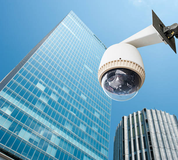 istock CCTV Camera or surveillance orperating with city building in bac 500910561