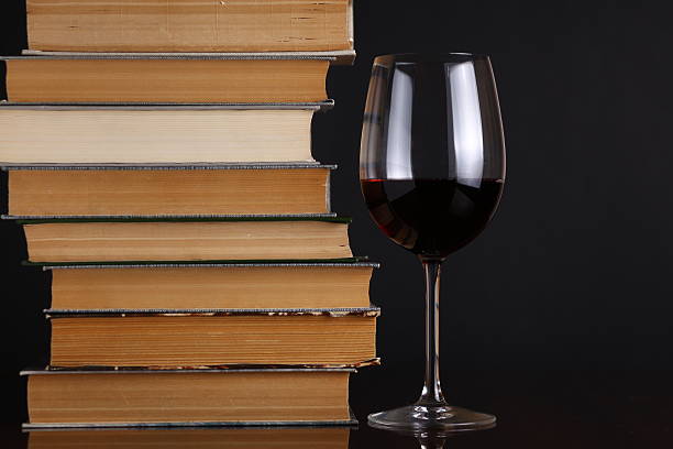 istock Wine glass and books 500910753