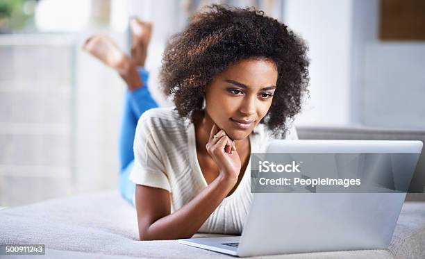 Surfing Her Favorite Sites Stock Photo - Download Image Now - 20-24 Years, 20-29 Years, Adult