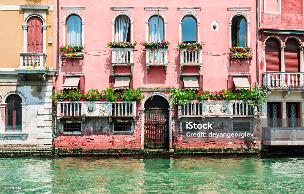 Ancient buildings in Venice Ancient buildings in Venice. Boats moored in the channel. View from the side of the water Ancient Stock Photo