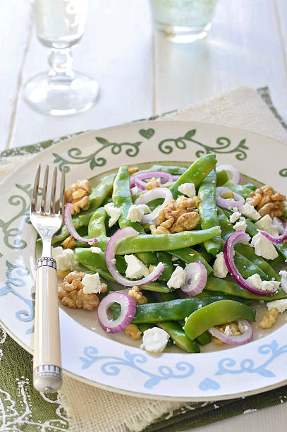 Green Bean, Walnut, and Feta Salad. Selective focus. stock photo