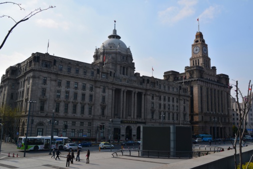 Shanghai, China - April 03, 2014: The Bund, a scenic waterfront area in central Shanghai. It is one of the most famous tourist destinations in Shanghai and houses buildings of various architectures.